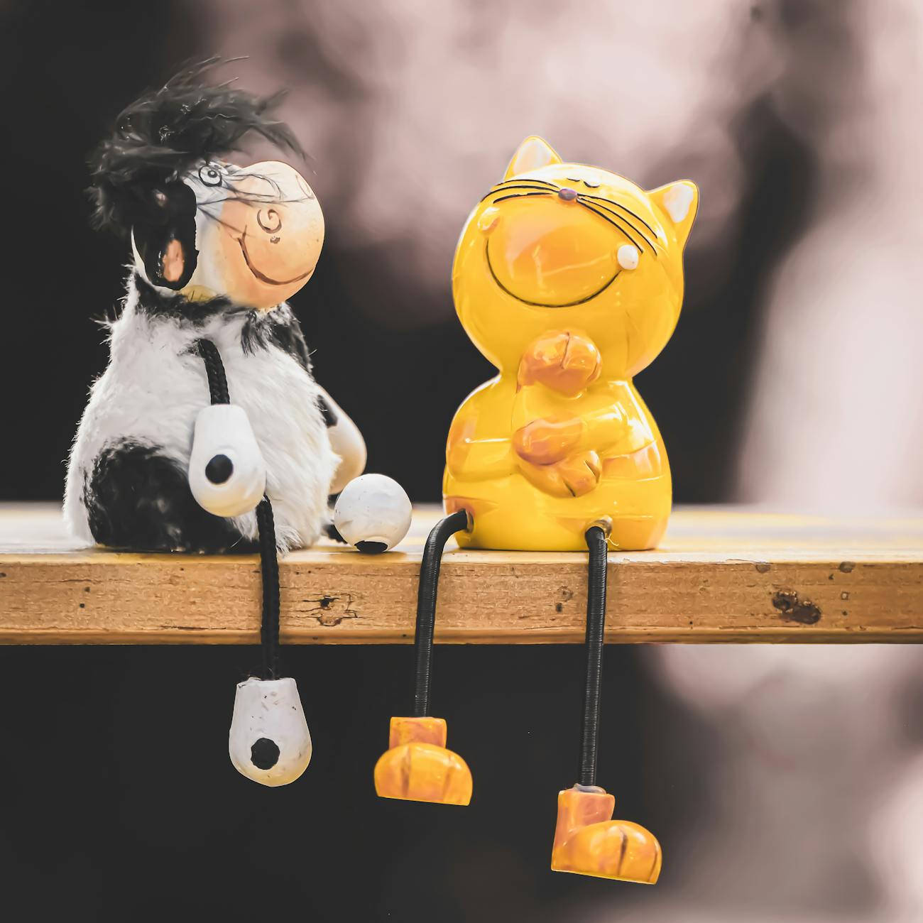 figurines of a cow and a cat